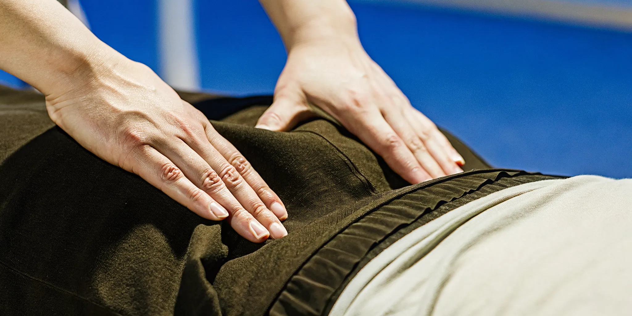Physical therapist demonstrating manual therapy technique for pelvic floor treatment in a Brooklyn clinic
