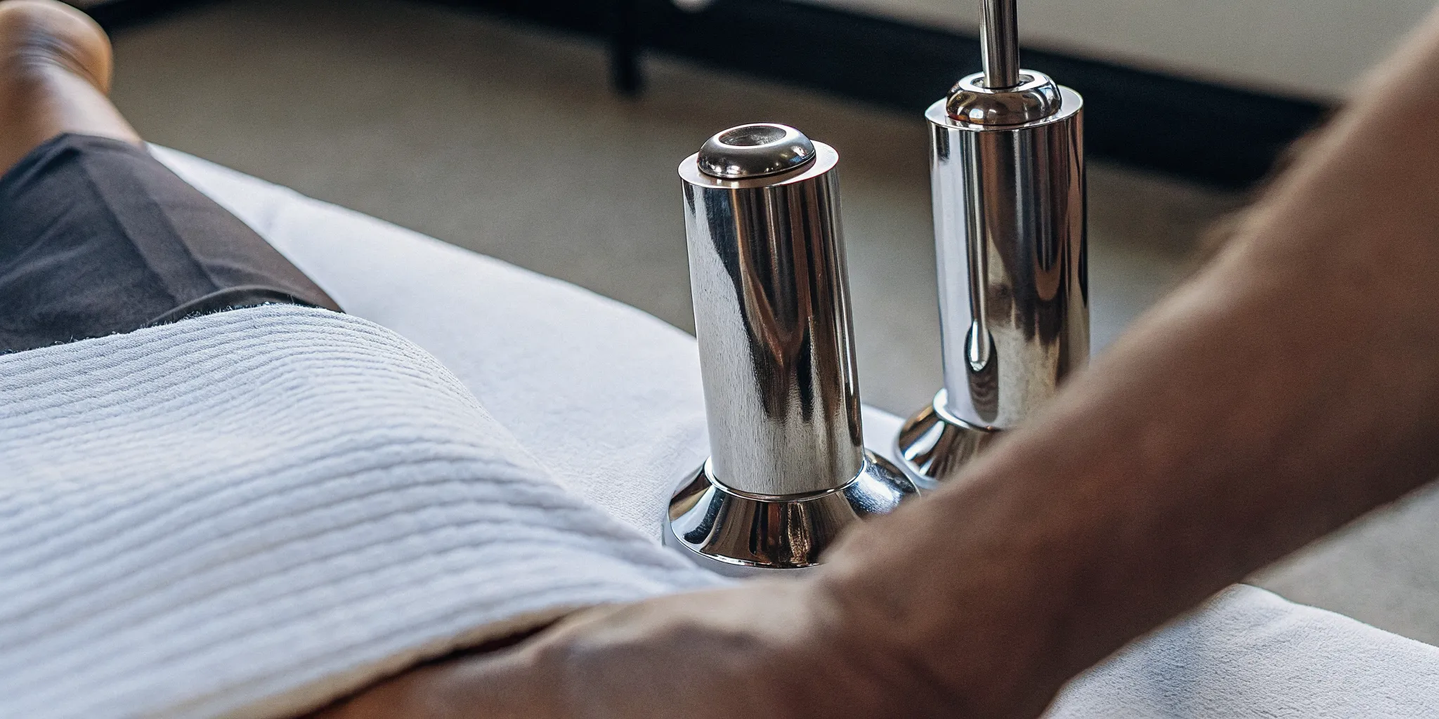 Close-up of stainless steel Graston Technique instruments used for instrument-assisted soft tissue mobilization