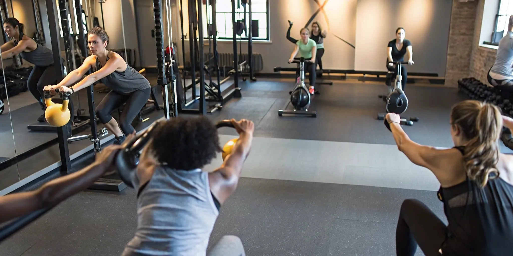 Members mixing strength cardio and recovery group fitness classes during the week