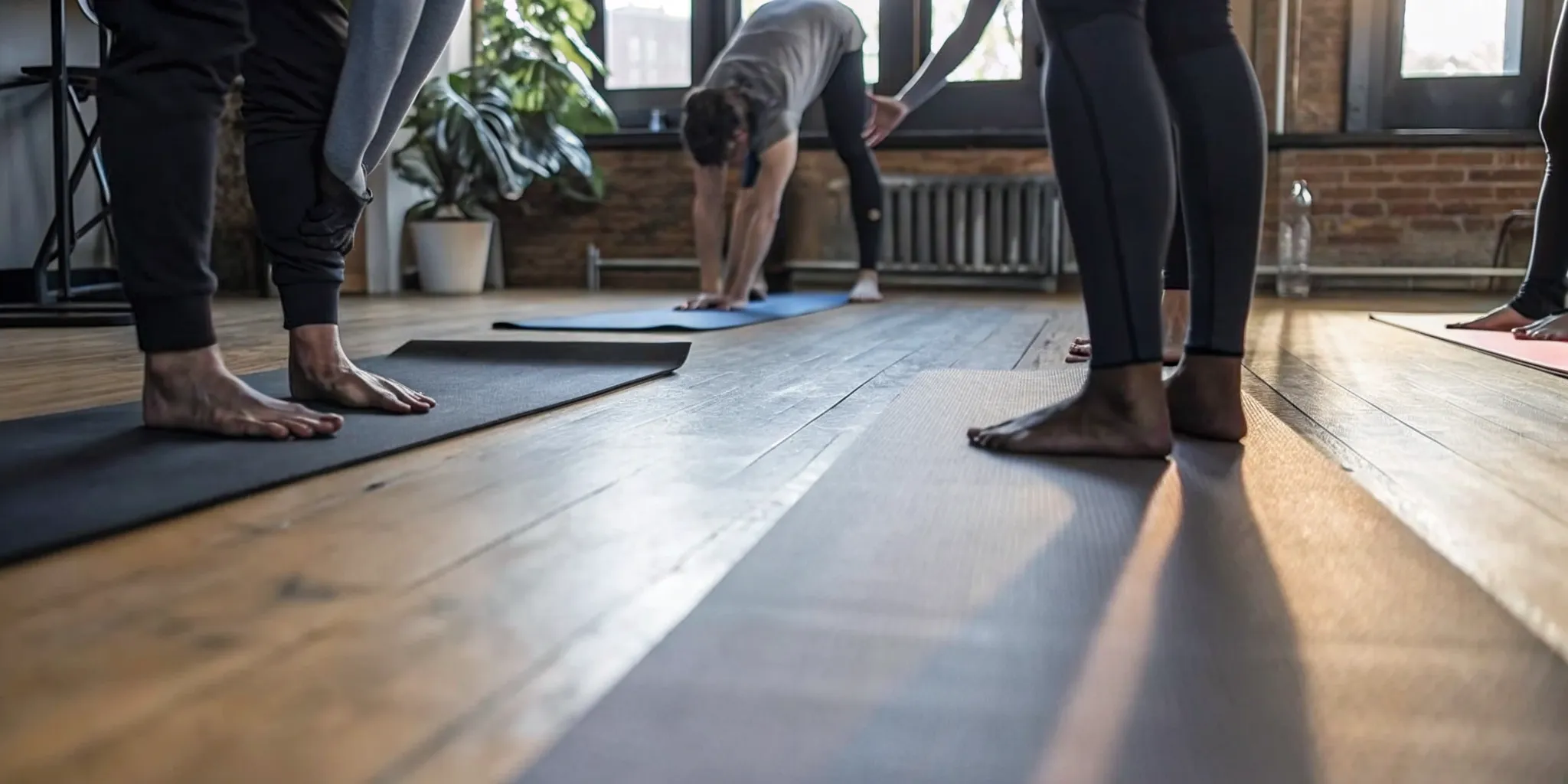 Instructor guiding a vinyasa flow sequence at Grind House Williamsburg