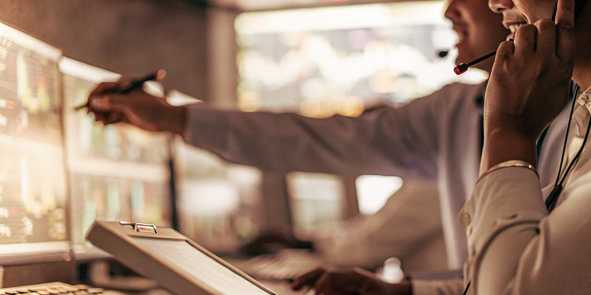 A manager provides call center coaching using performance data and call examples.