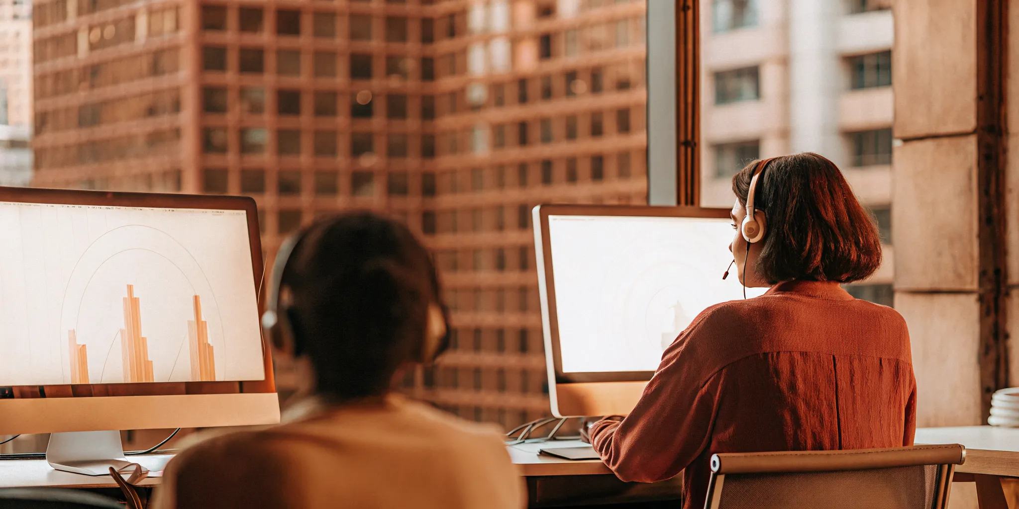 Call center agents using productivity tools on computers to improve efficiency.