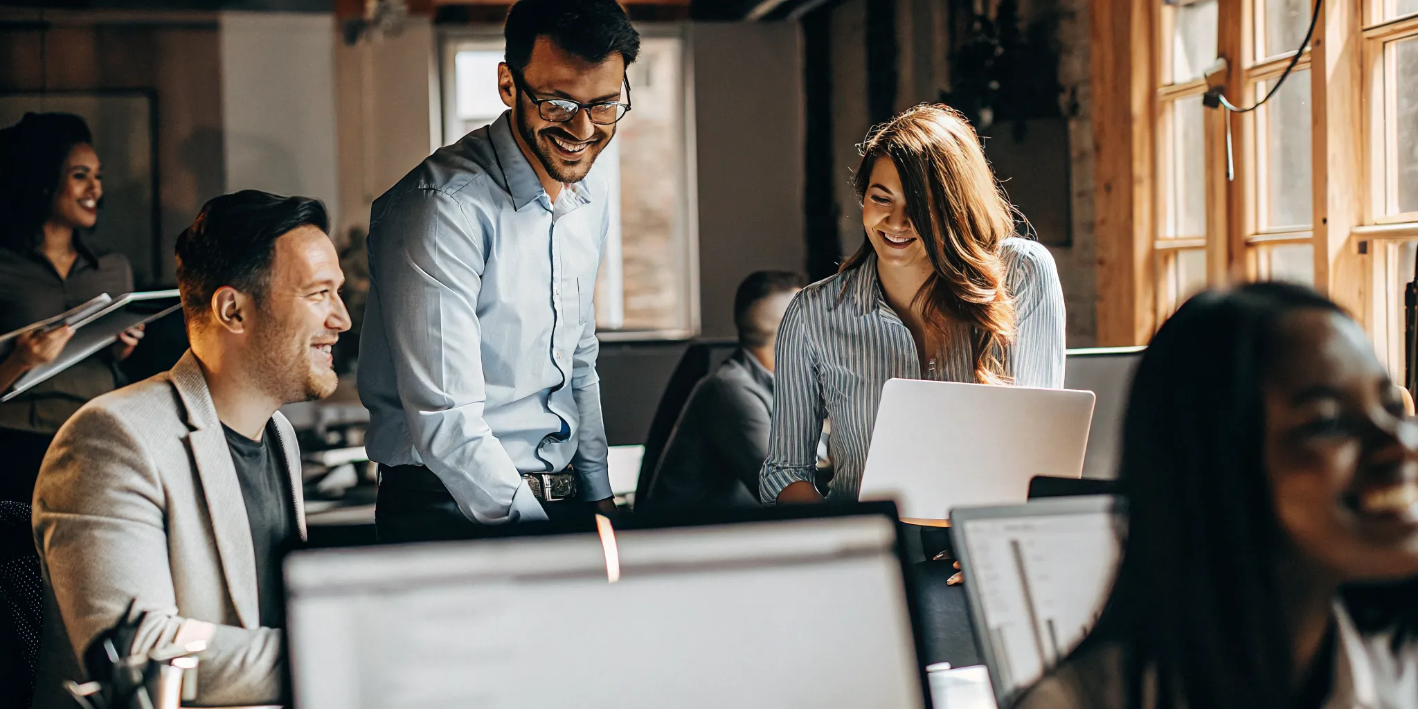 Contact center team collaborating in a modern office