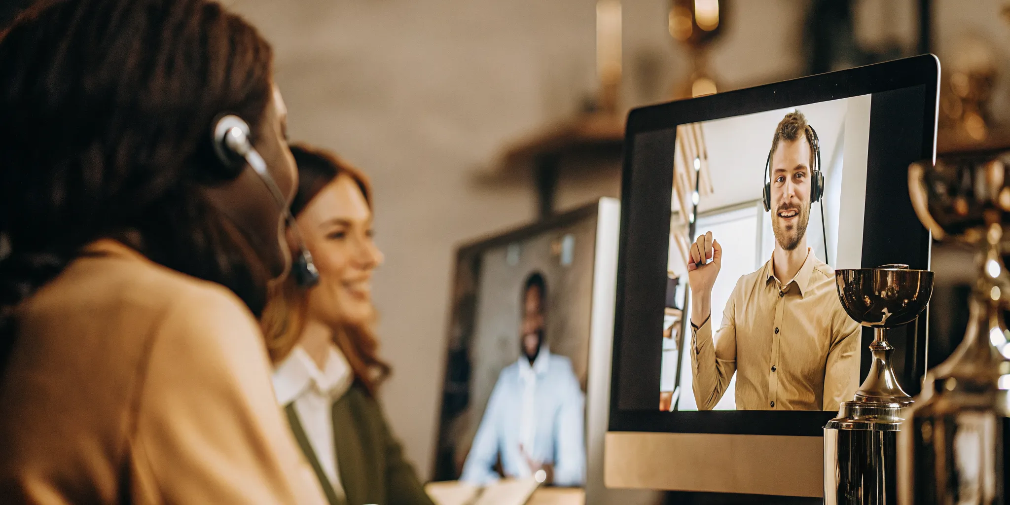 Contact center team lead engaging a remote agent during a video recognition moment
