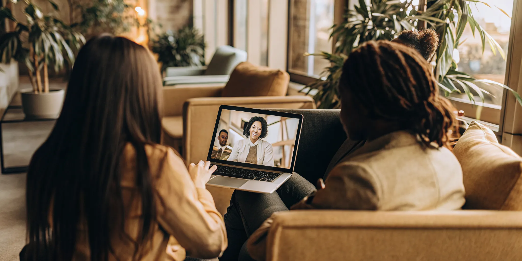 Quality assurance supervisor coaching a hybrid team with a remote agent on video