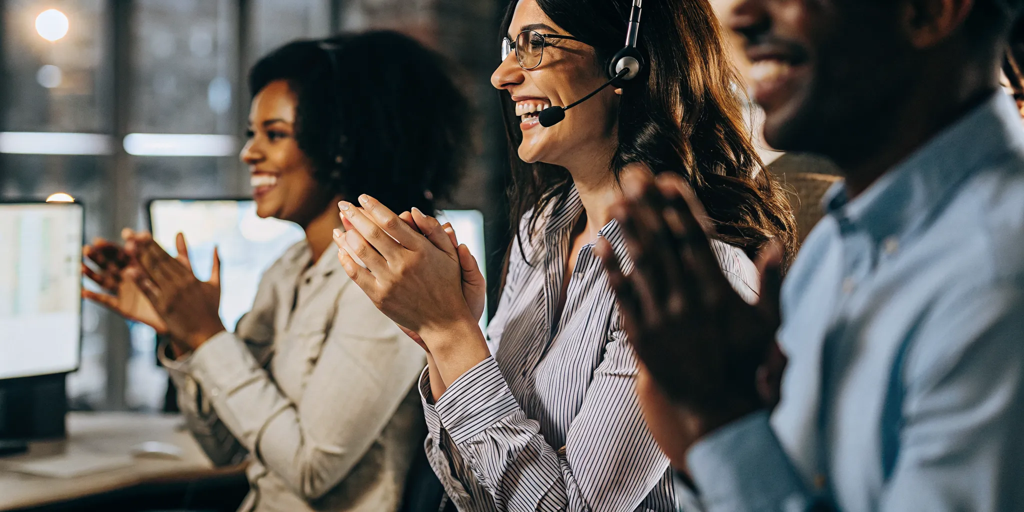 Contact center team celebrating an agent recognition moment