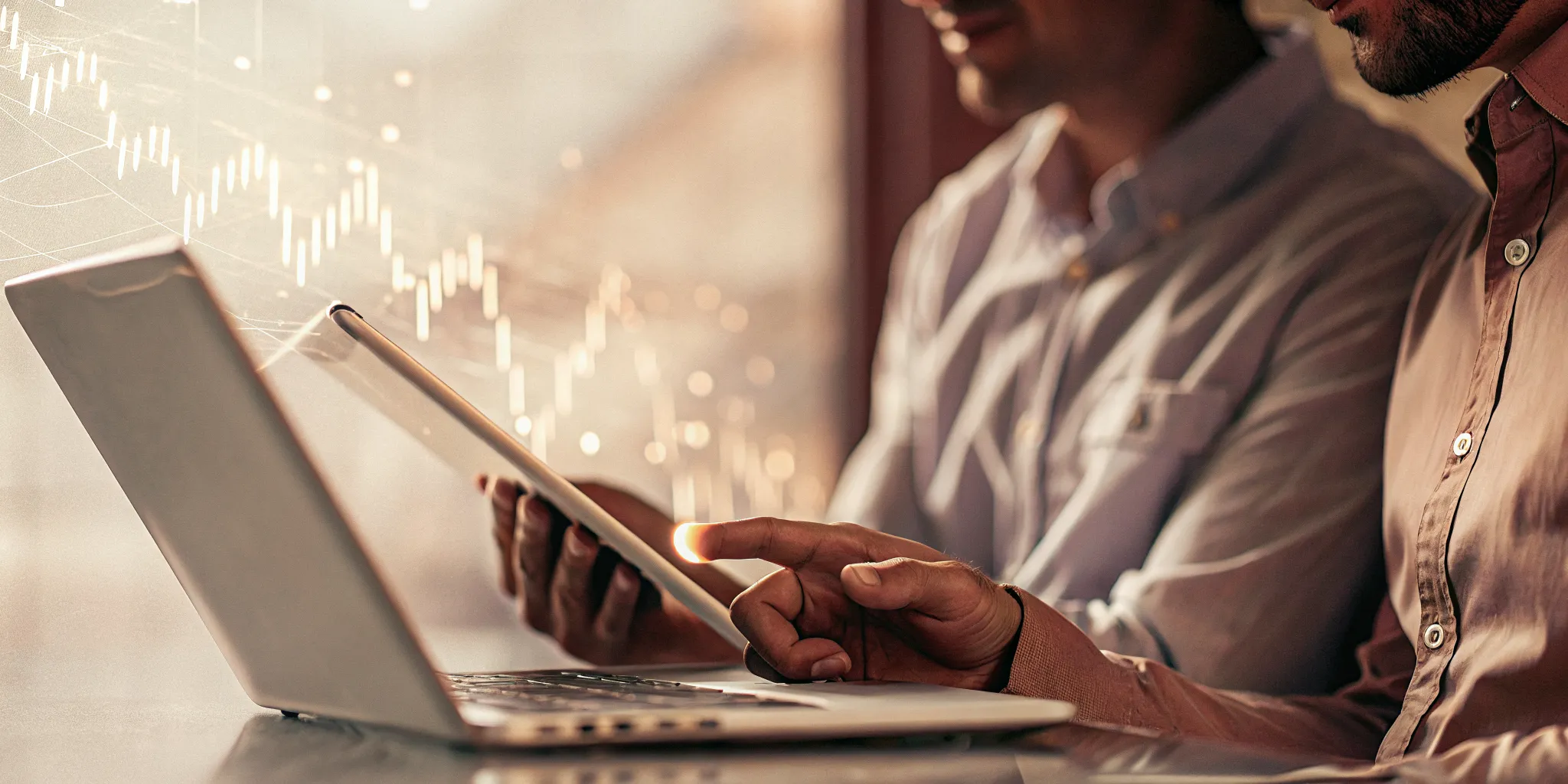 Professionals using a process performance measurement system on a laptop.