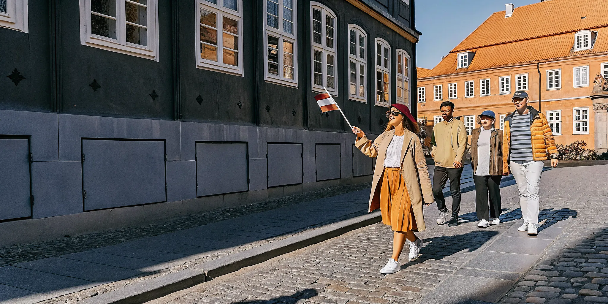Multi-day guided group tour exploring a European historic city with a professional tour guide leading the way