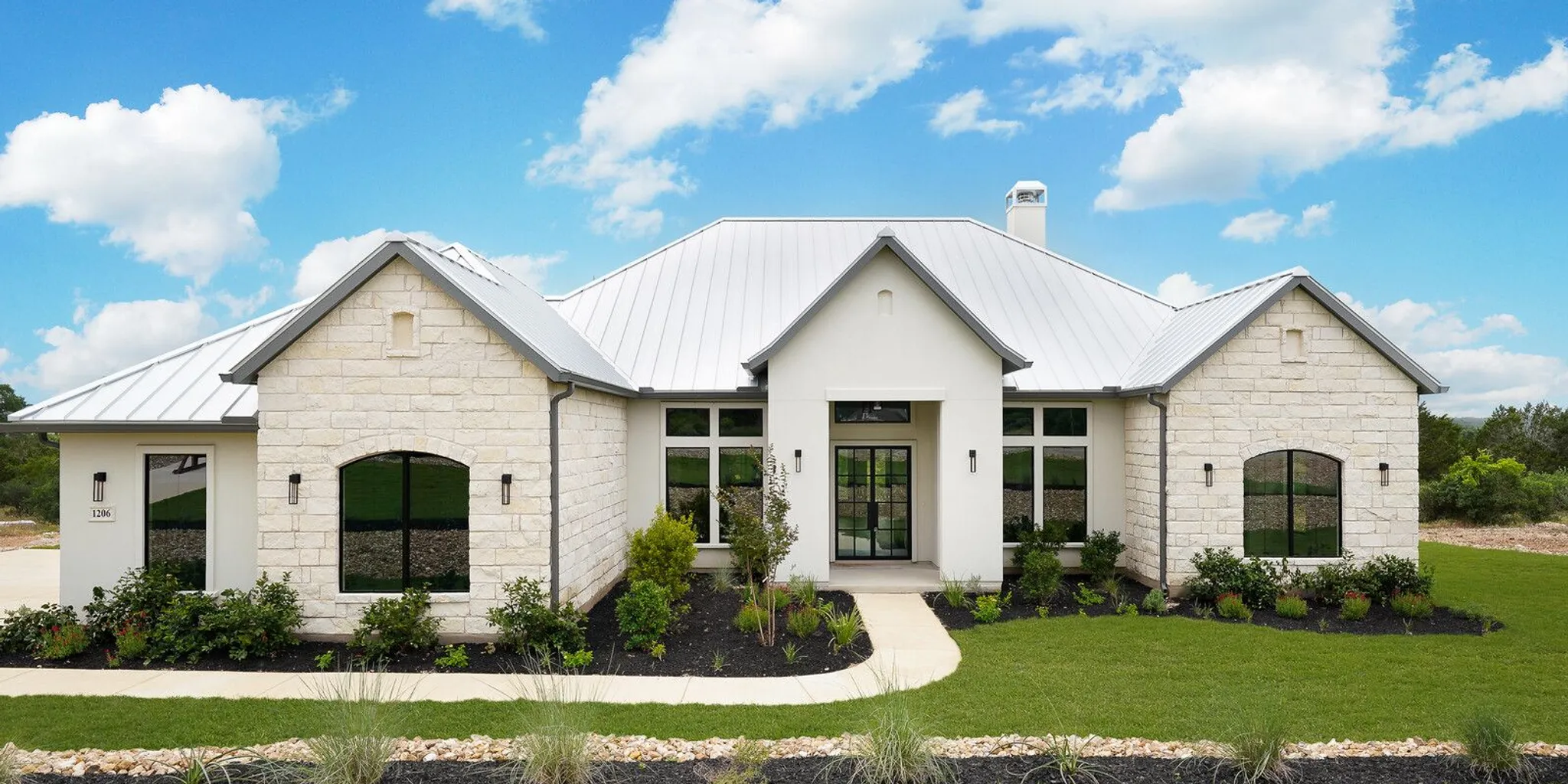 Builder and homeowner reviewing a Texas Hill Country custom home floor plan