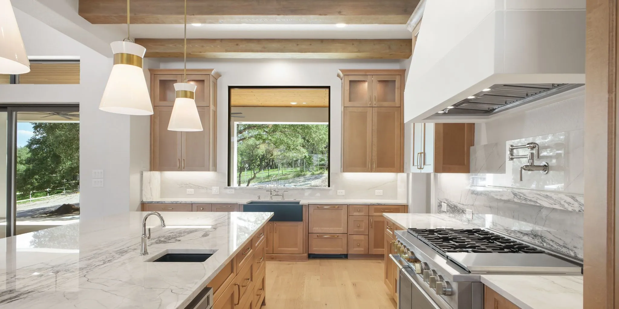 Custom Texas Hill Country home with limestone, cedar accents, and a covered patio