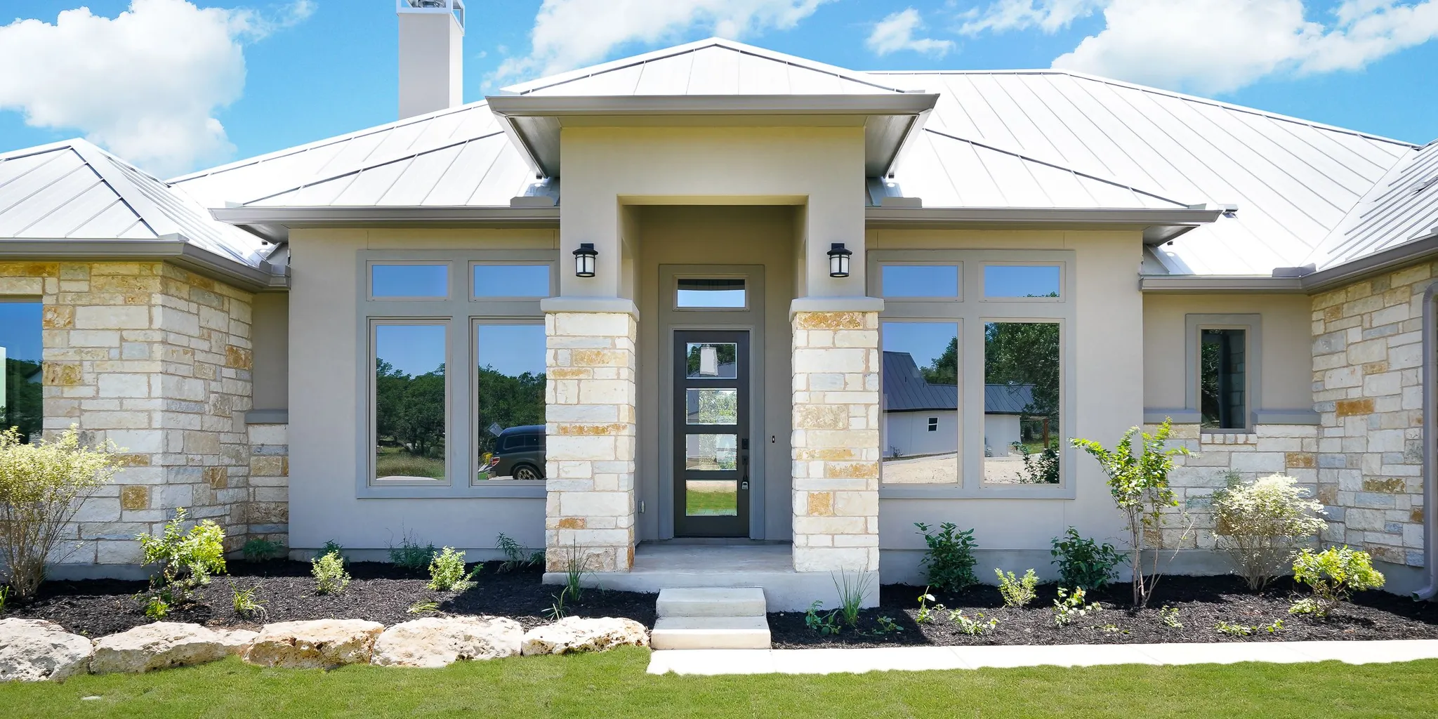 Texas Hill Country custom home exterior with covered patio