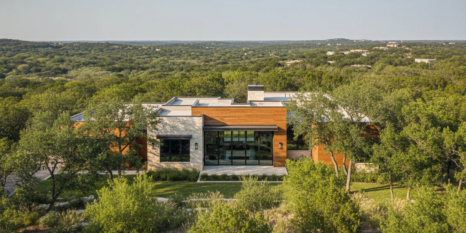 Custom Texas Hill Country home with stone exterior on a landscaped lot