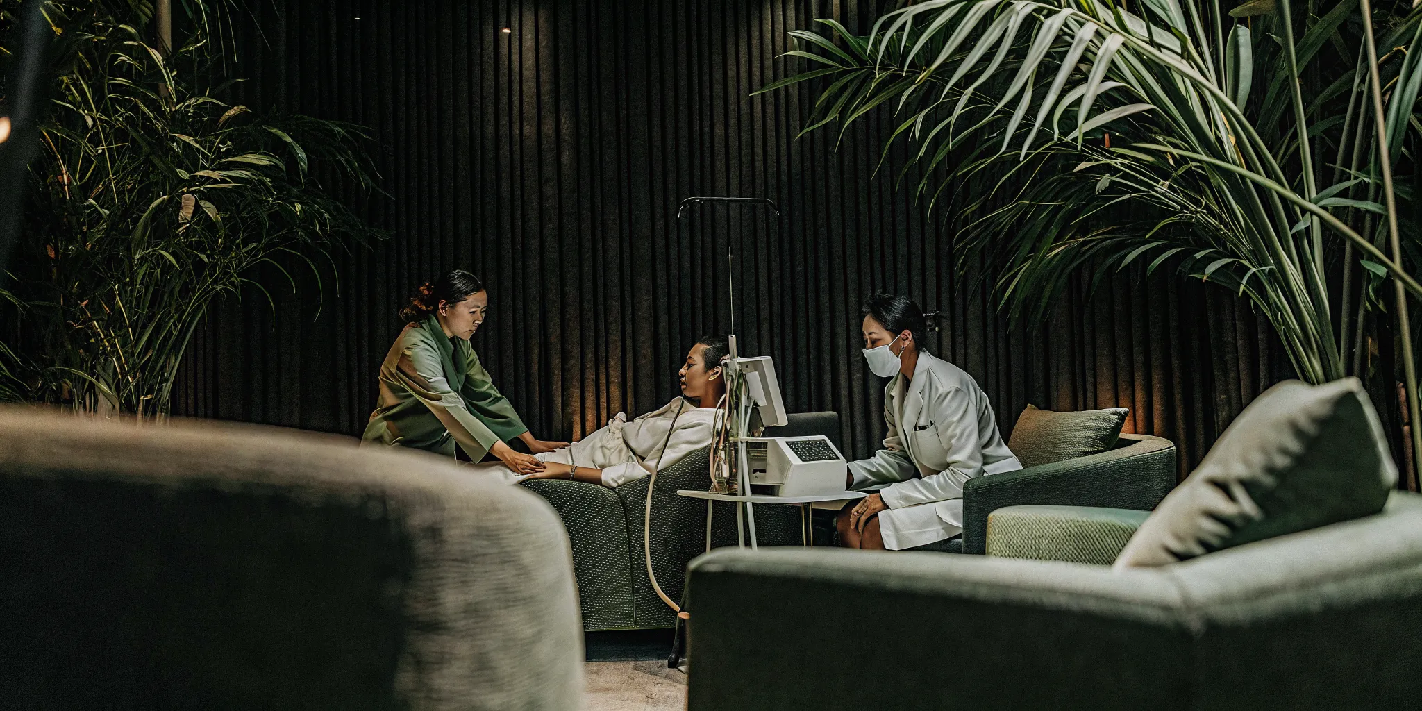 Medical team monitoring a patient in a luxury detox facility with physician-led care