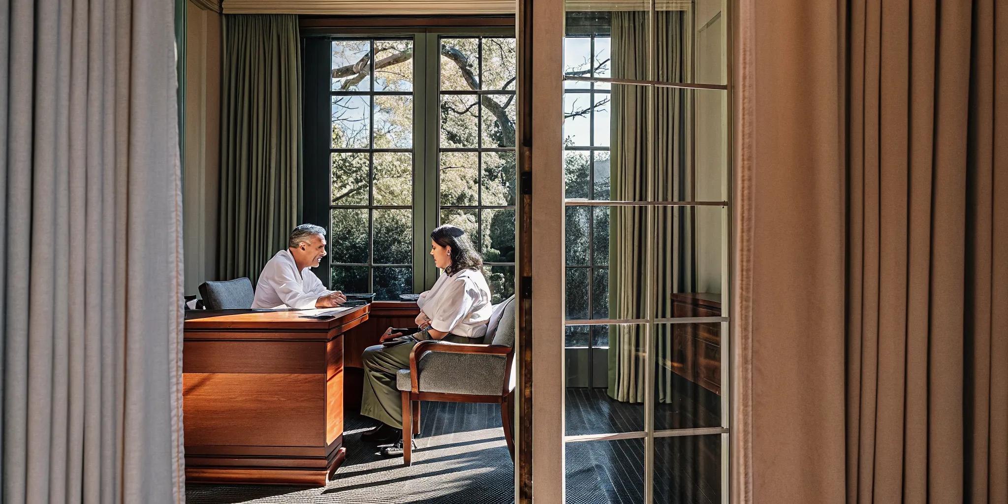 Professional discussing confidential rehab options with a treatment specialist