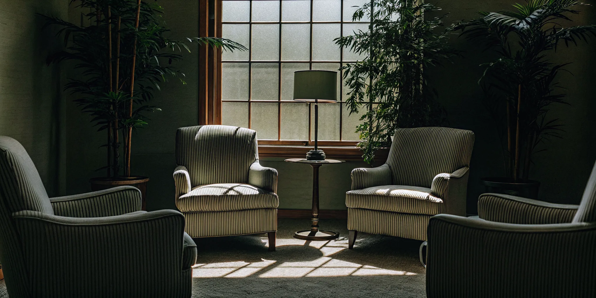 Comfortable therapy session room at luxury Ohio rehab center with armchairs and warm natural lighting