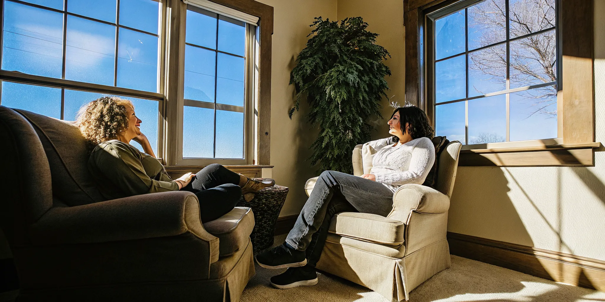 Therapist and client speaking in a bright Ohio treatment center session room