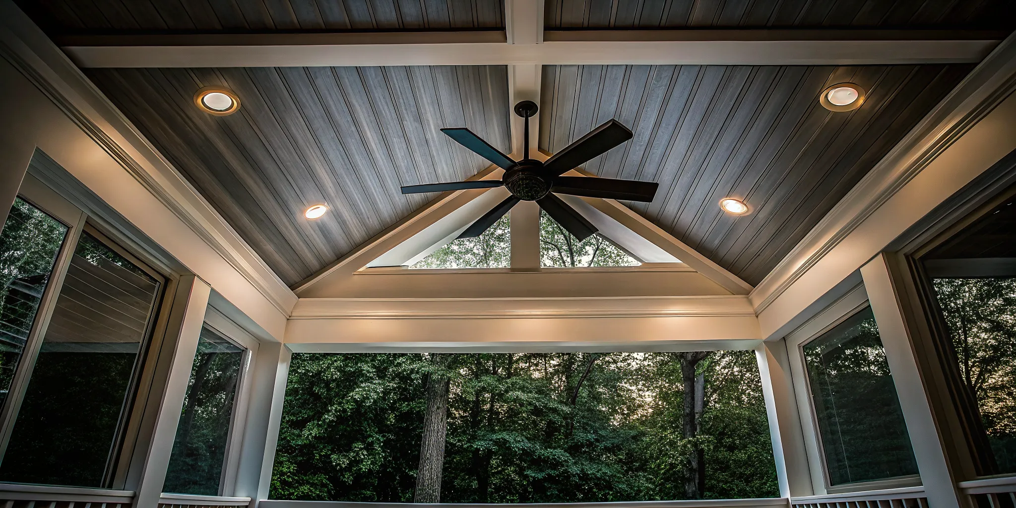 Finished wood ceiling and lighting detail in a custom screened porch