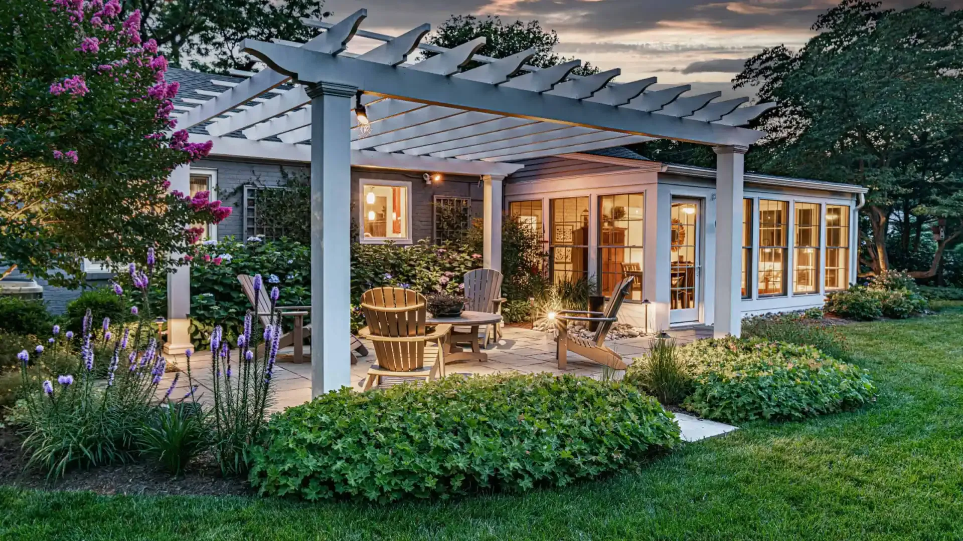 Luxury outdoor kitchen with stone countertops and built-in grill designed by DiSabatino