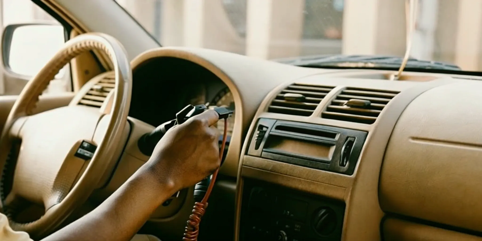Technician installing an ignition interlock device in a vehicle at Budget IID's Roseville service center