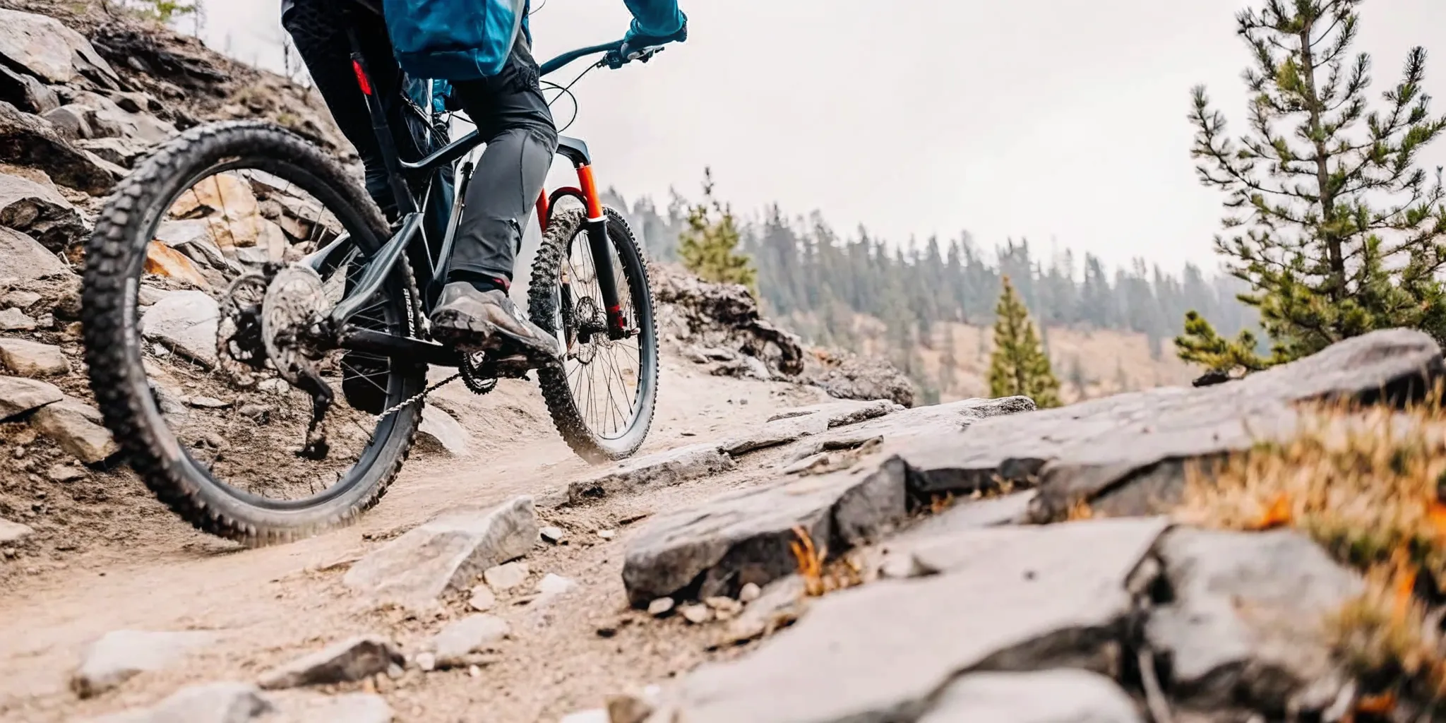 Electric bike climbing a steep rocky trail in the Cascade mountains near Bend Oregon with fat tires gripping the terrain