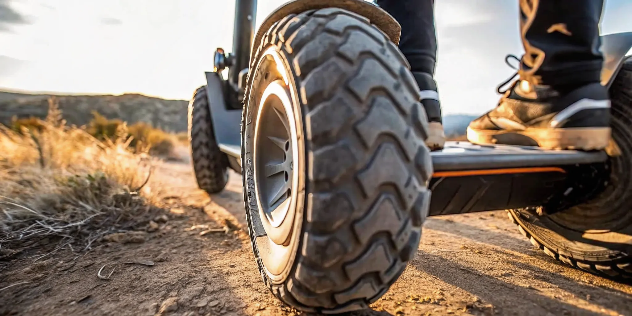 Heavy-duty rugged tires of Segway Xyber electric bike on a dusty mountain trail in Bend, Oregon