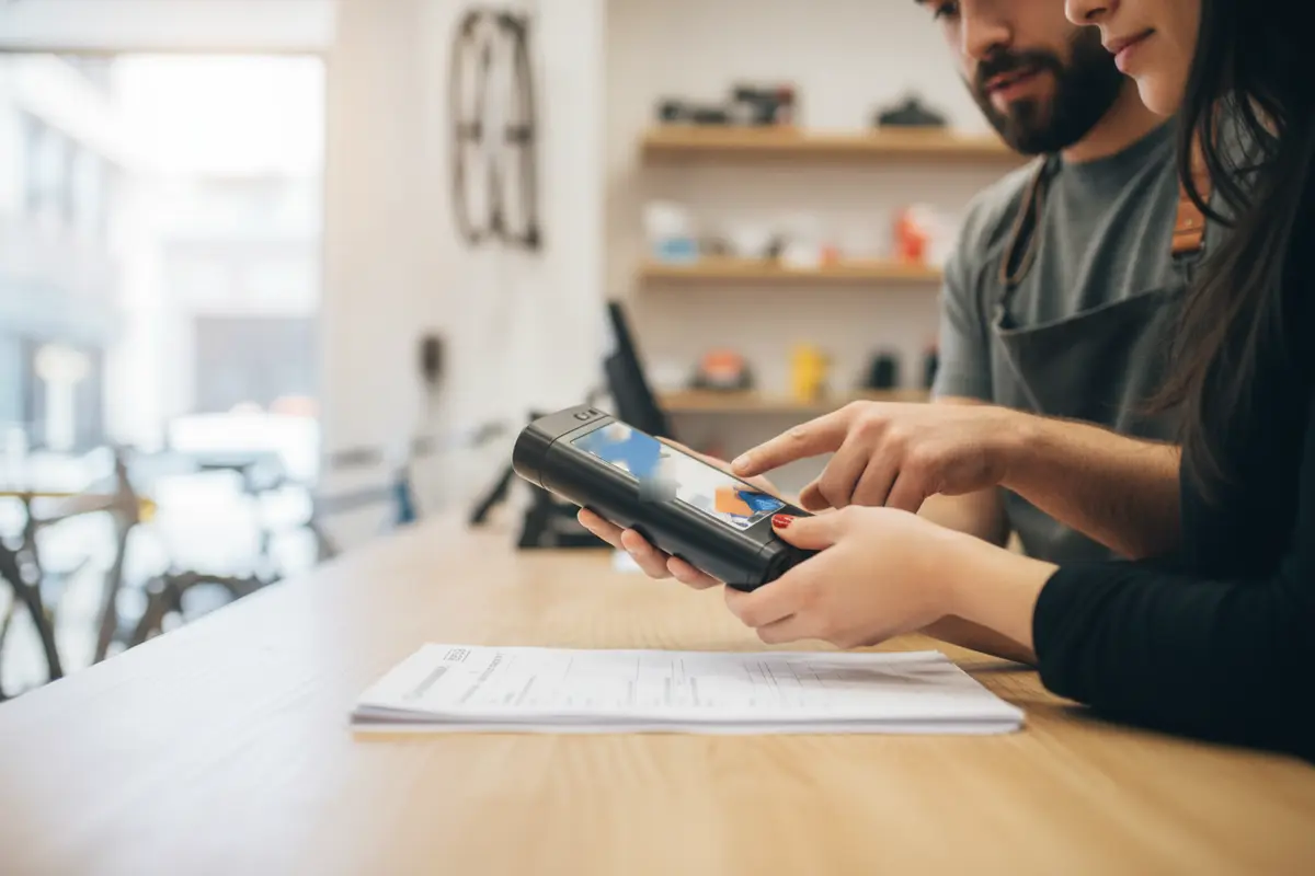 Shopper checking a used electric bike battery and warranty details