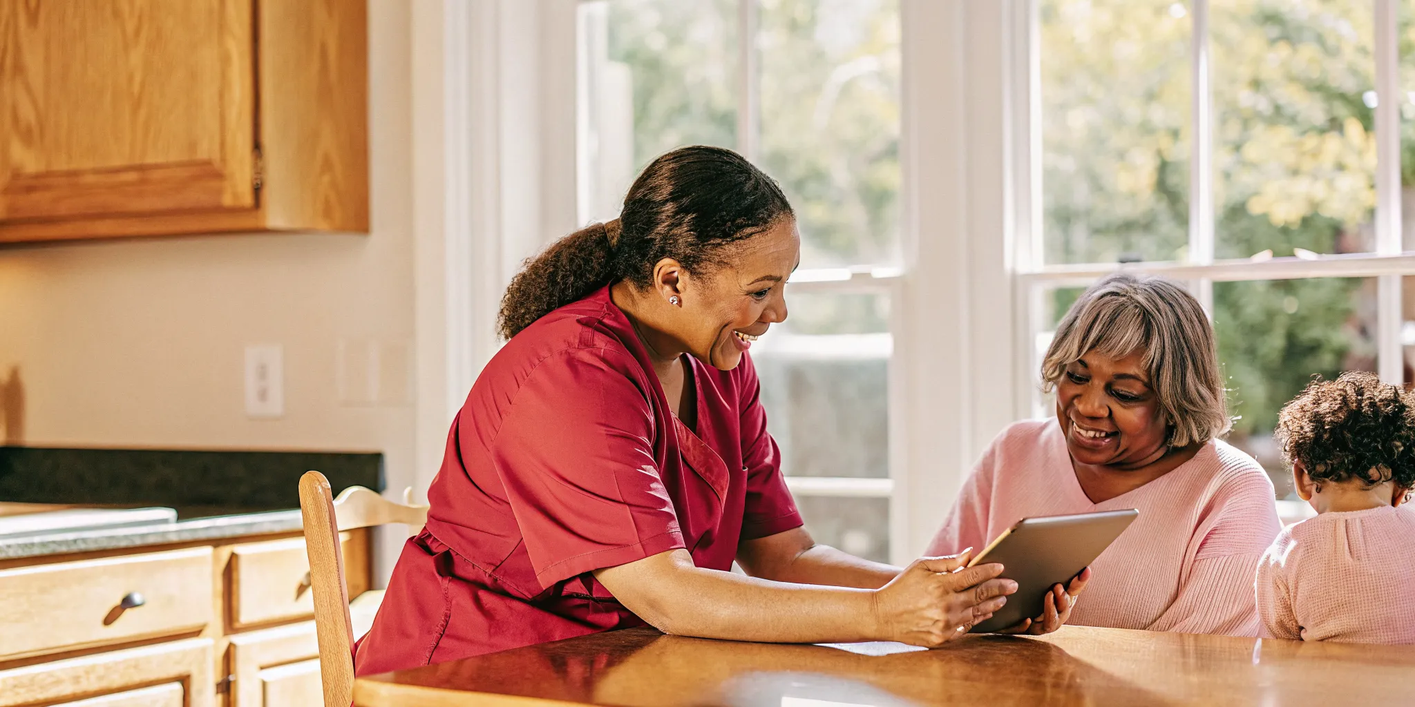Pediatric nurse reviewing a care plan with a parent in a Georgia home