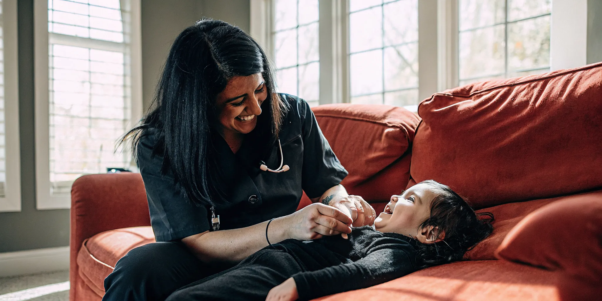 Pediatric nurse caring for a child with cerebral palsy in a Georgia home setting