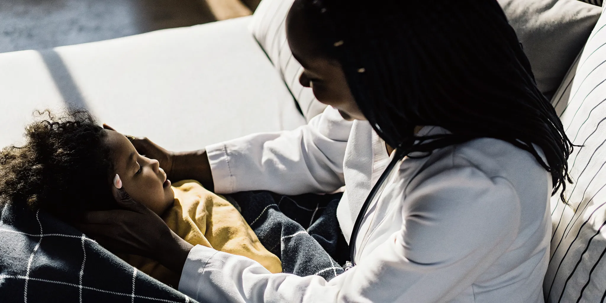Pediatric home health nurse checking a child with a VP shunt at home in Georgia