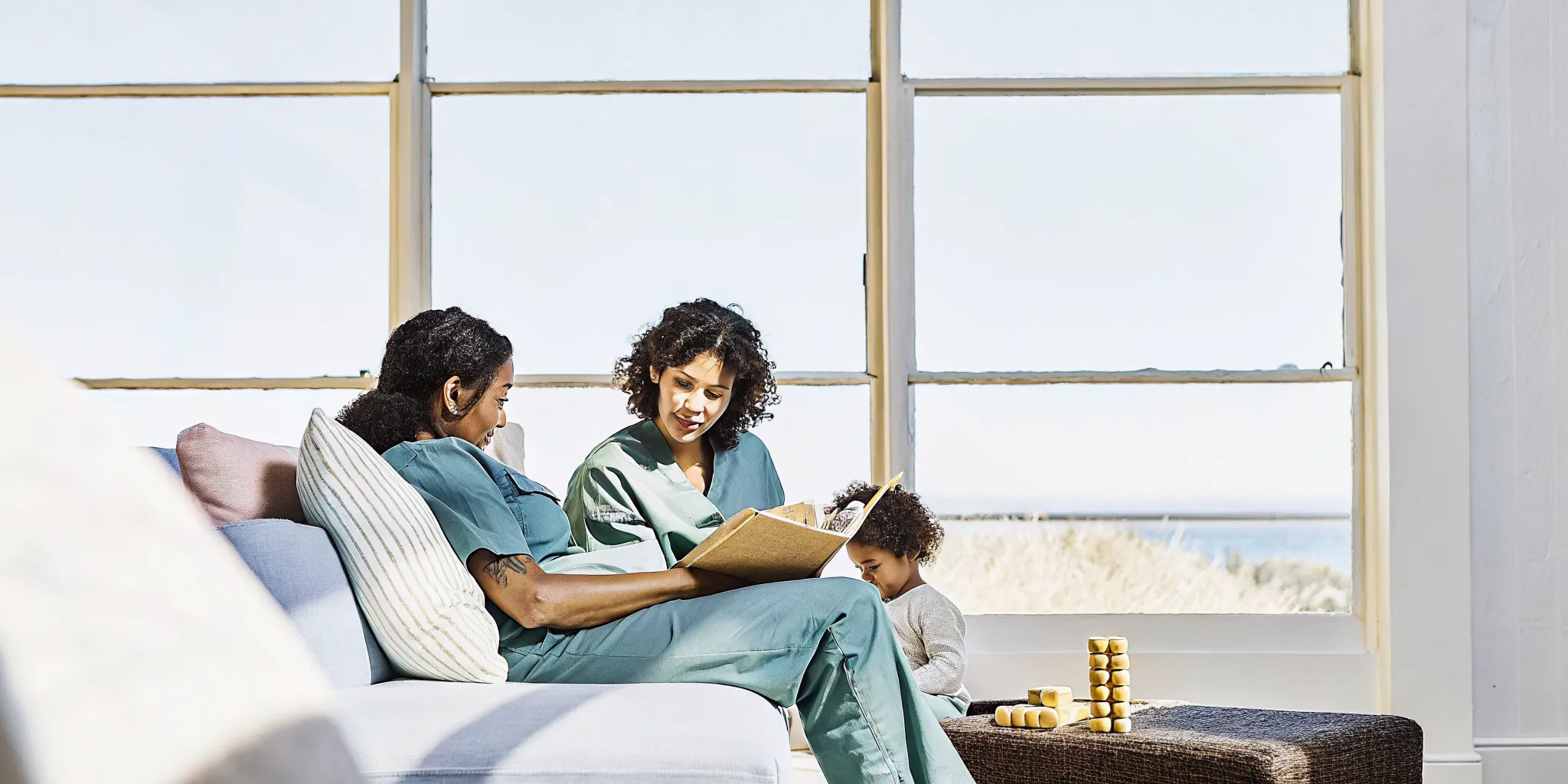 Nurse and parent reviewing a pediatric Model of Care plan together in a coastal Georgia home