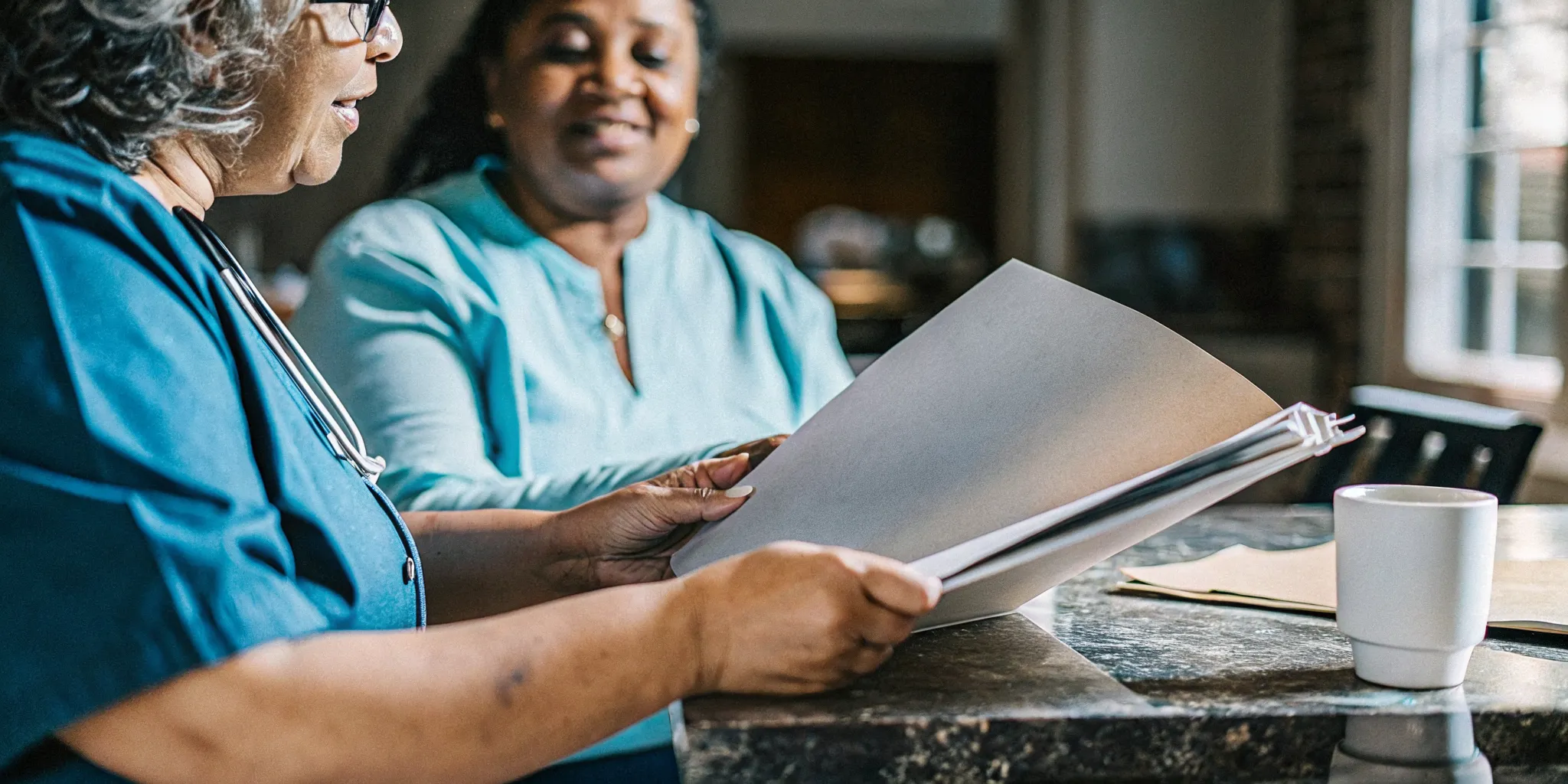 Parent and pediatric home care nurse preparing records for a GAPP application