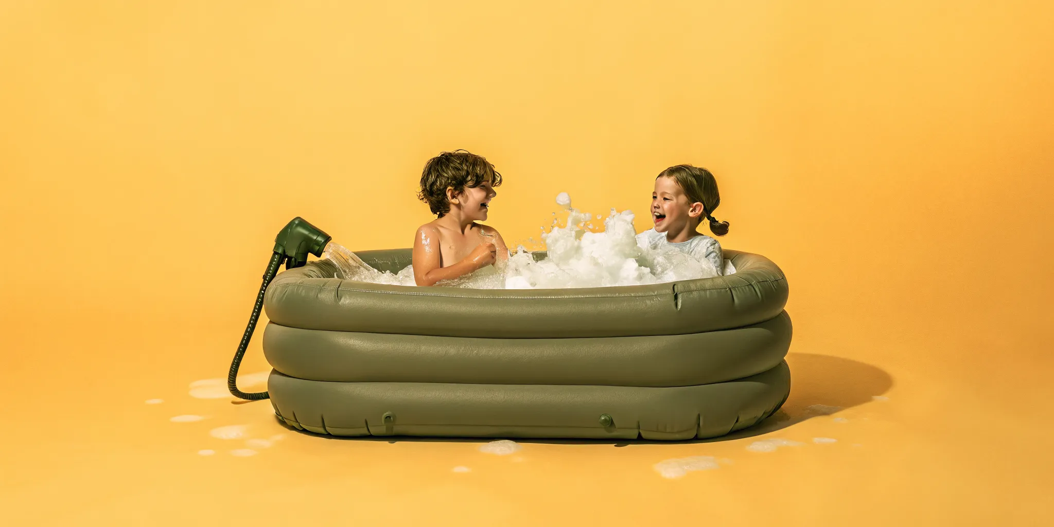 Kids playing in a backyard foam party with deep piles of suds from a foam cannon