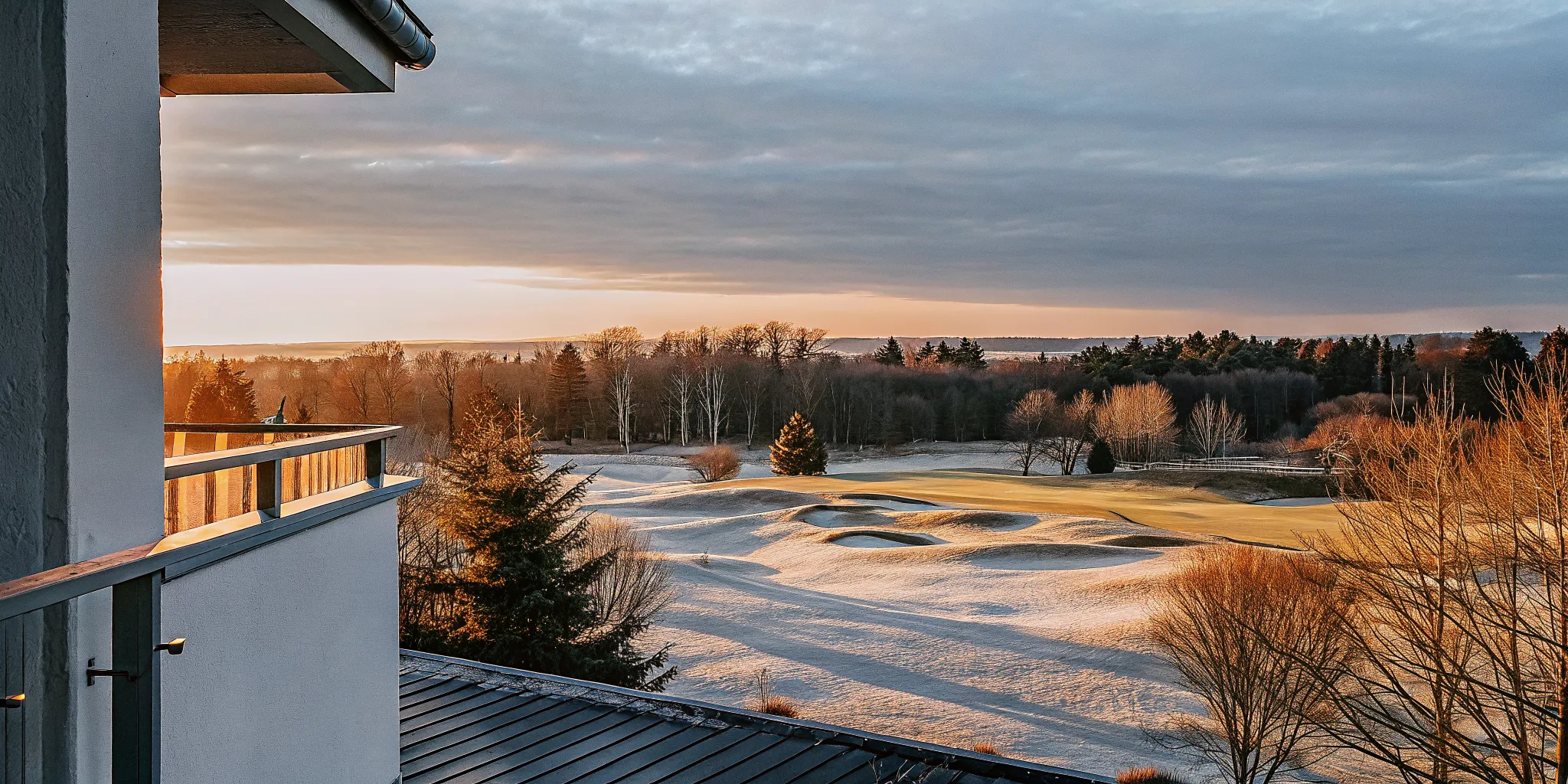 Aerial view of a golf course fairway at sunset representing a property ready for market