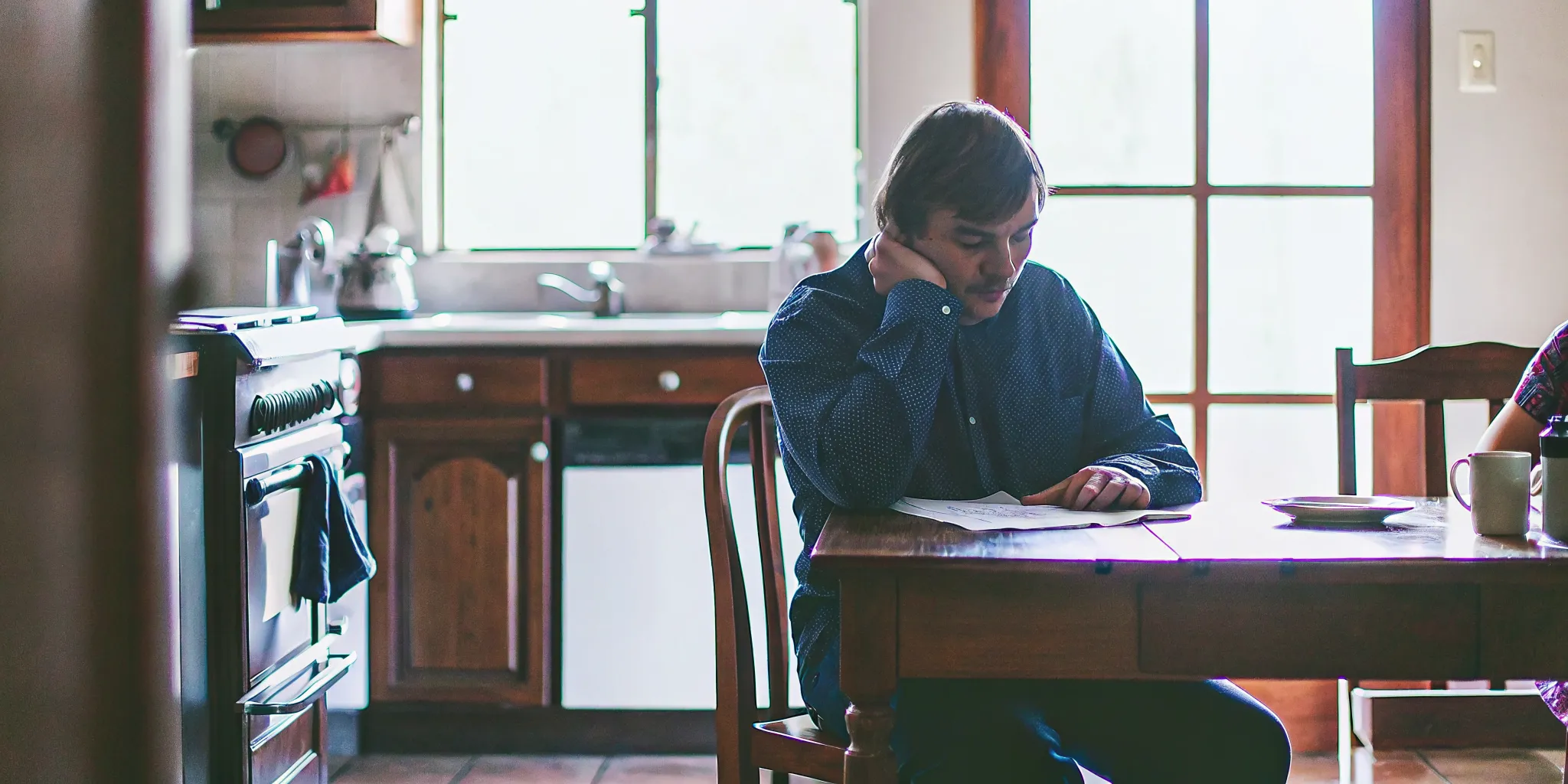 Person sitting at a table working on a recovery worksheet
