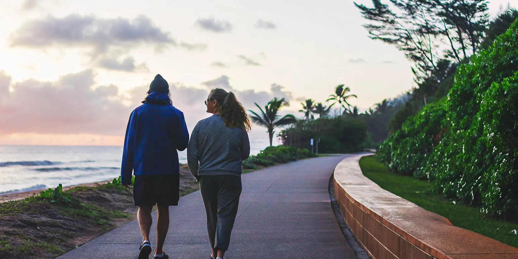 Two people walking together as part of ongoing recovery support