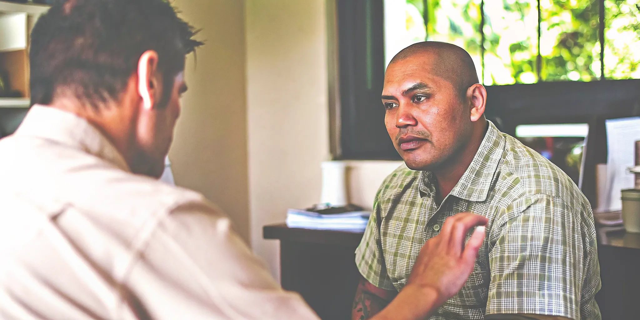 Veteran discussing outpatient addiction treatment with a counselor in Hawaii