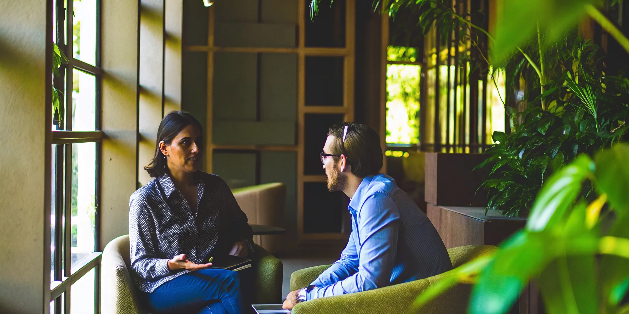 Employee having a private planning conversation with a supportive manager about outpatient rehab