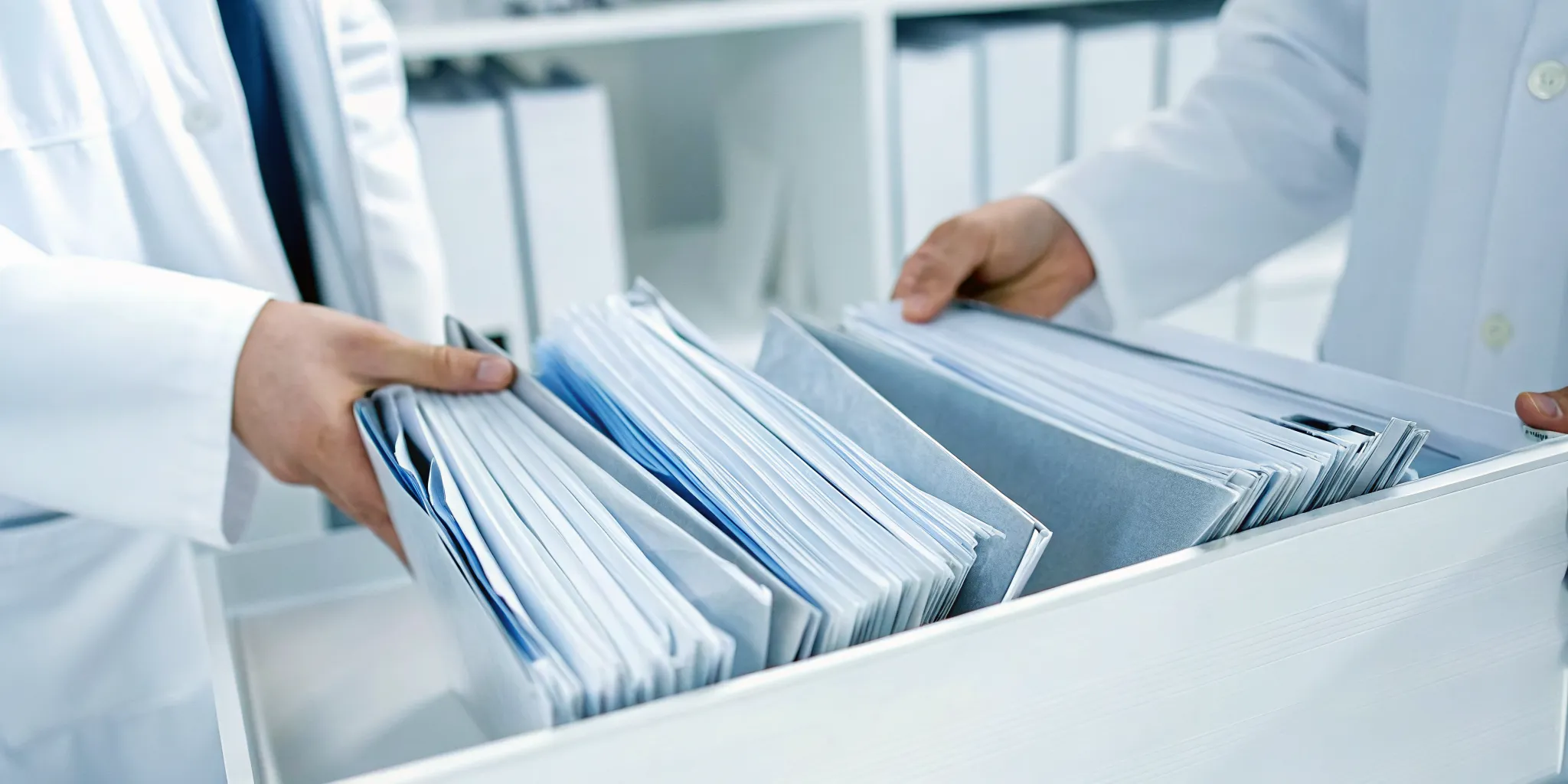 Licensed medical practice team reviewing COA biologics procurement records