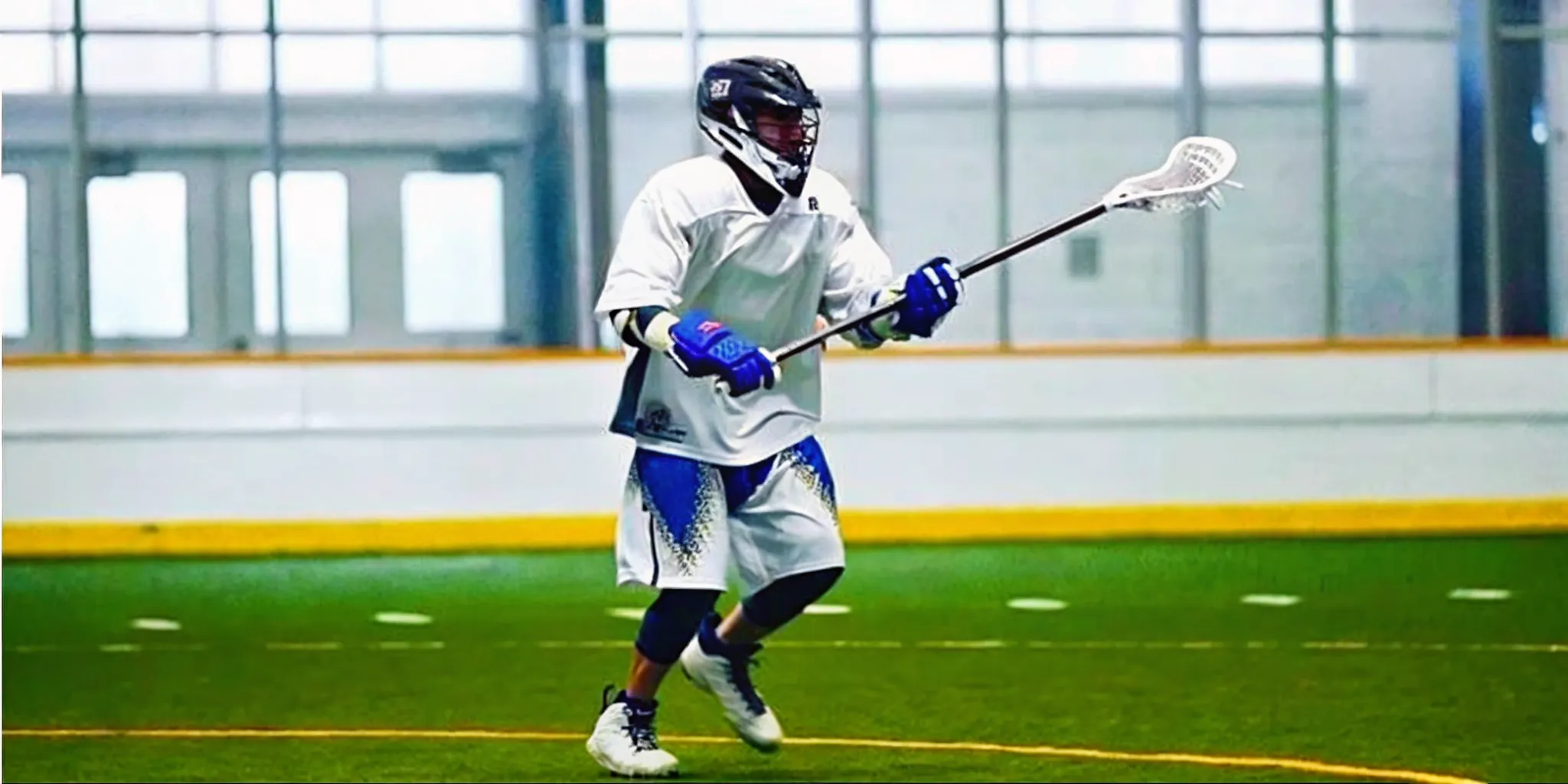 Box lacrosse player wearing a custom team uniform during indoor play