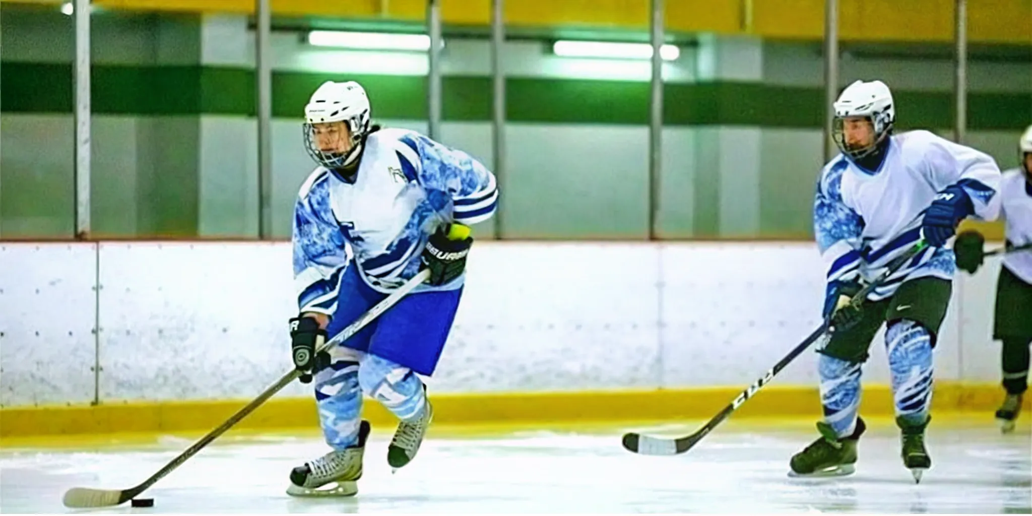 Ice hockey players wearing coordinated sublimated hockey jerseys