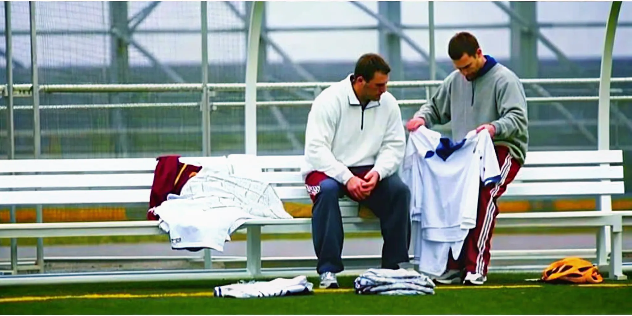 Lacrosse team managers comparing custom apparel while planning a uniform budget