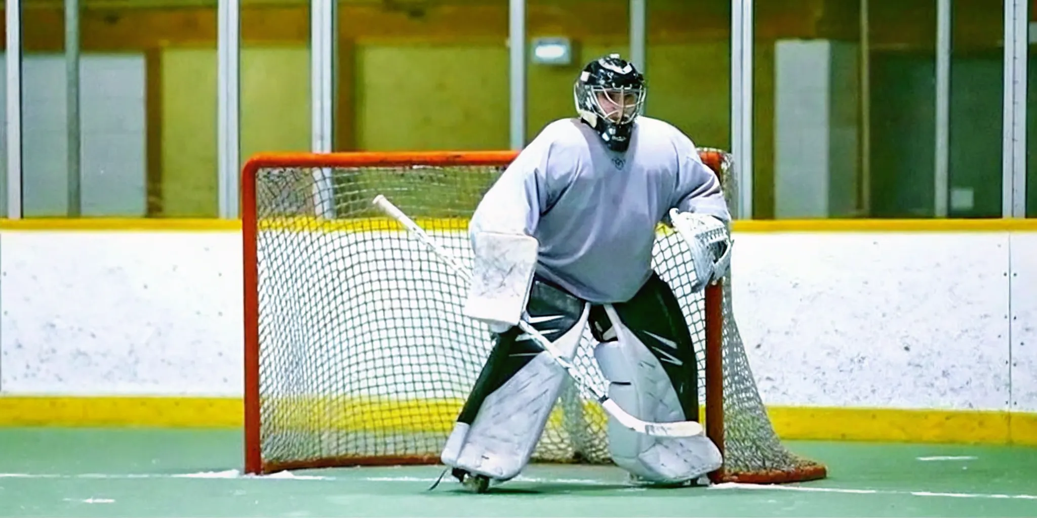 Box lacrosse goalie jersey fitted over full indoor goalie protective gear