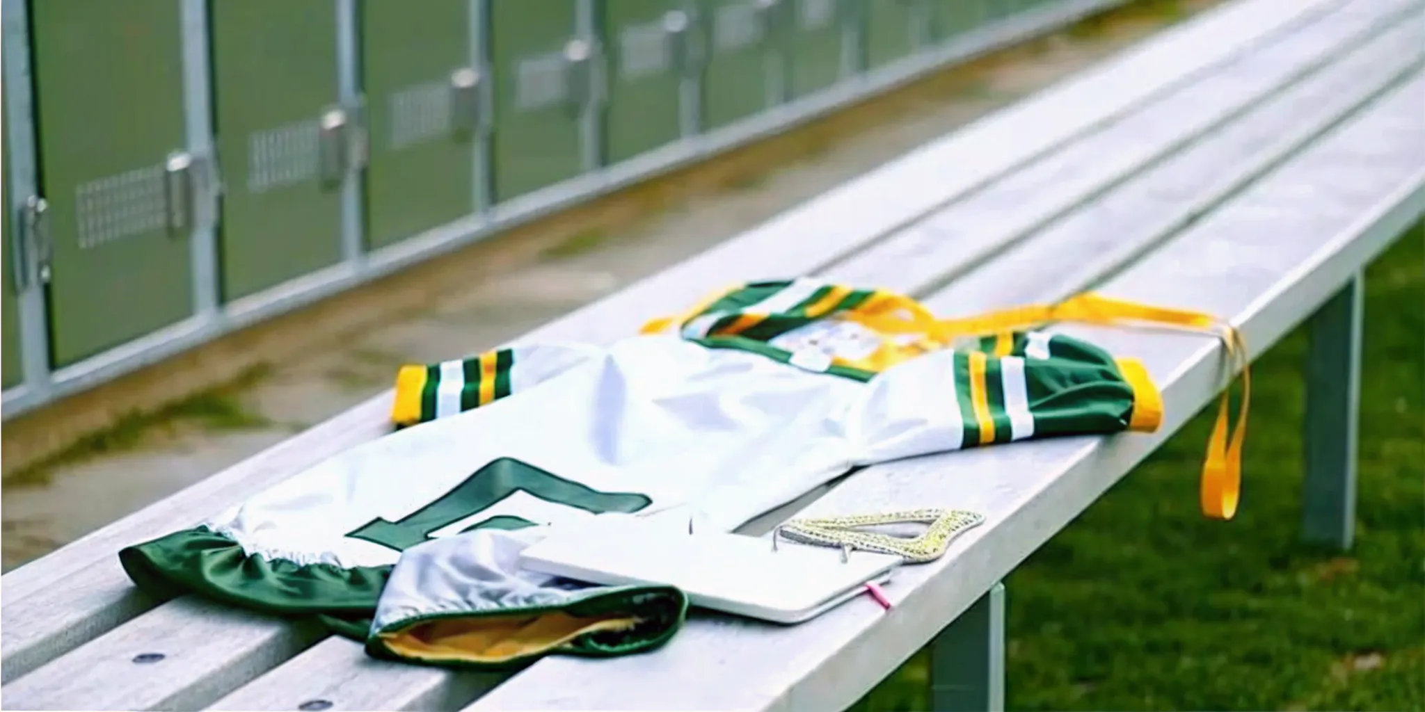 Lacrosse jersey, measuring tape, and roster prepared for a team sizing session