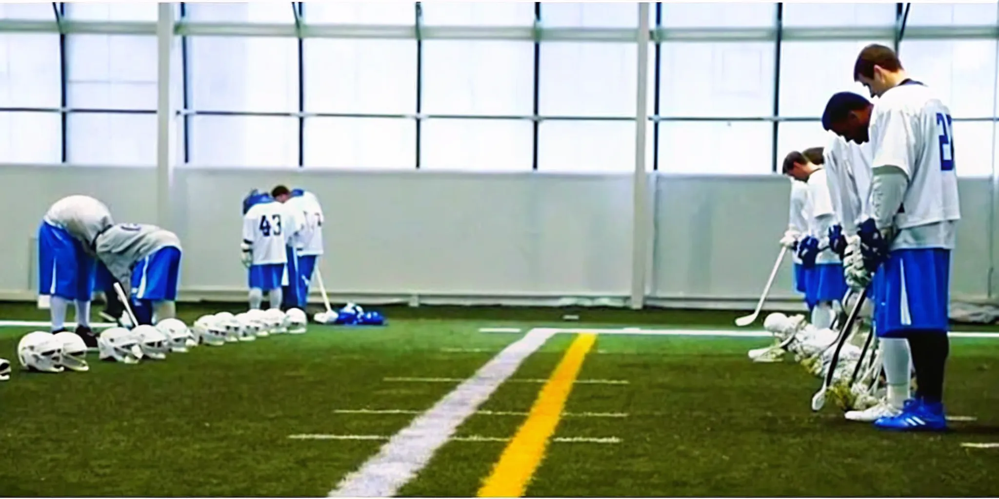 Box lacrosse players reviewing gear for a lacrosse team store