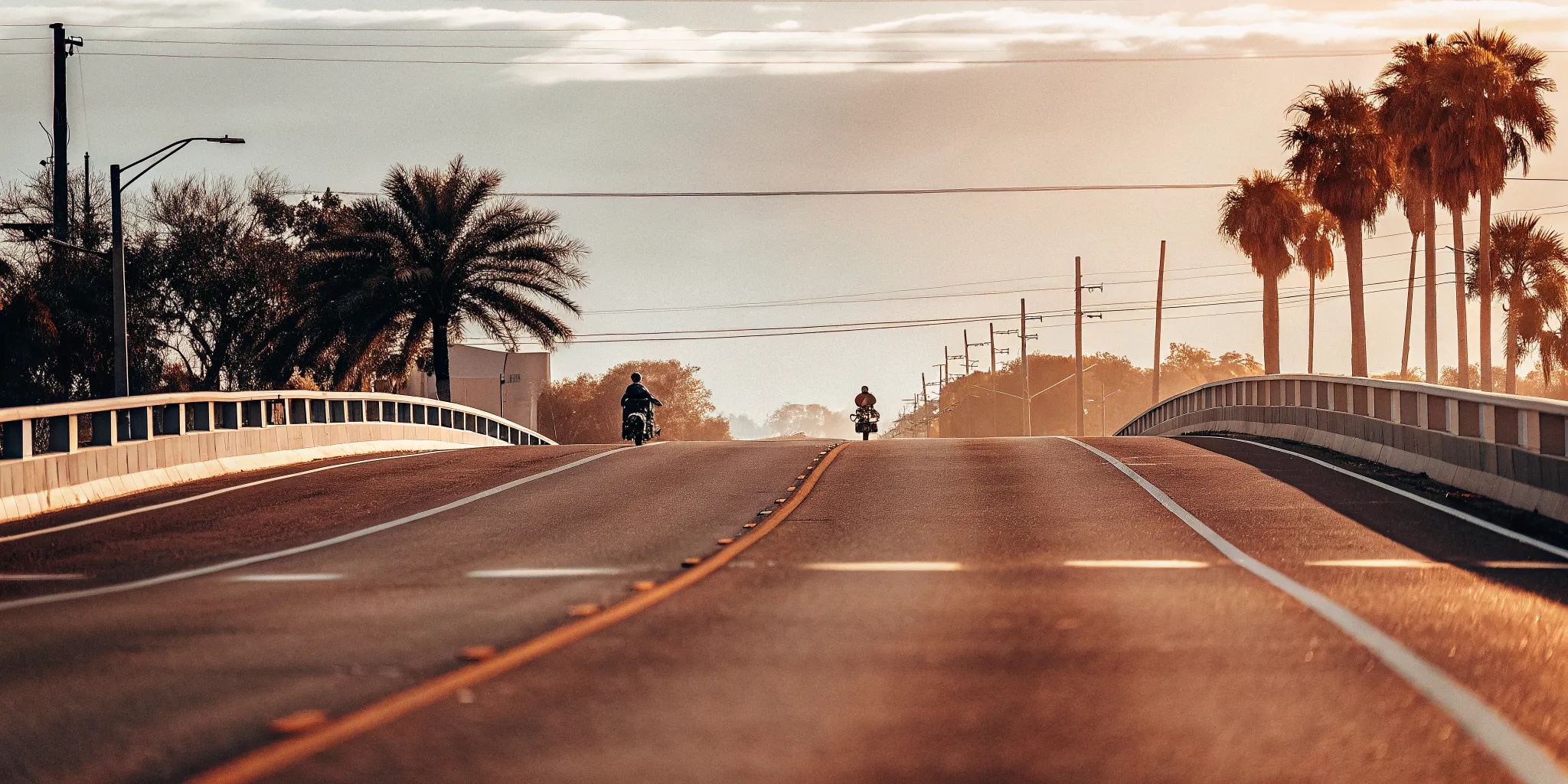 Open Florida roadway with a motorcycle riding in the travel lane