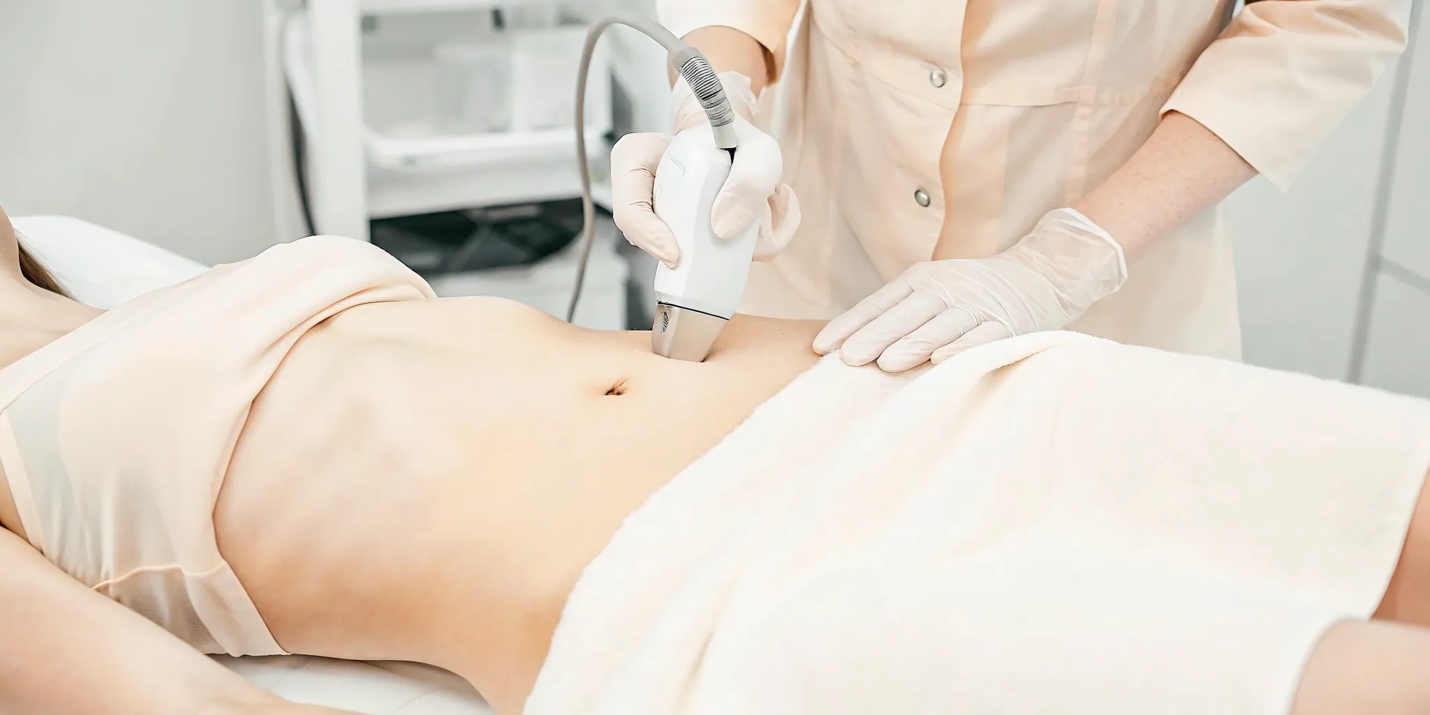 Emsculpt Neo electromagnetic treatment applicator on a patient during a body contouring session