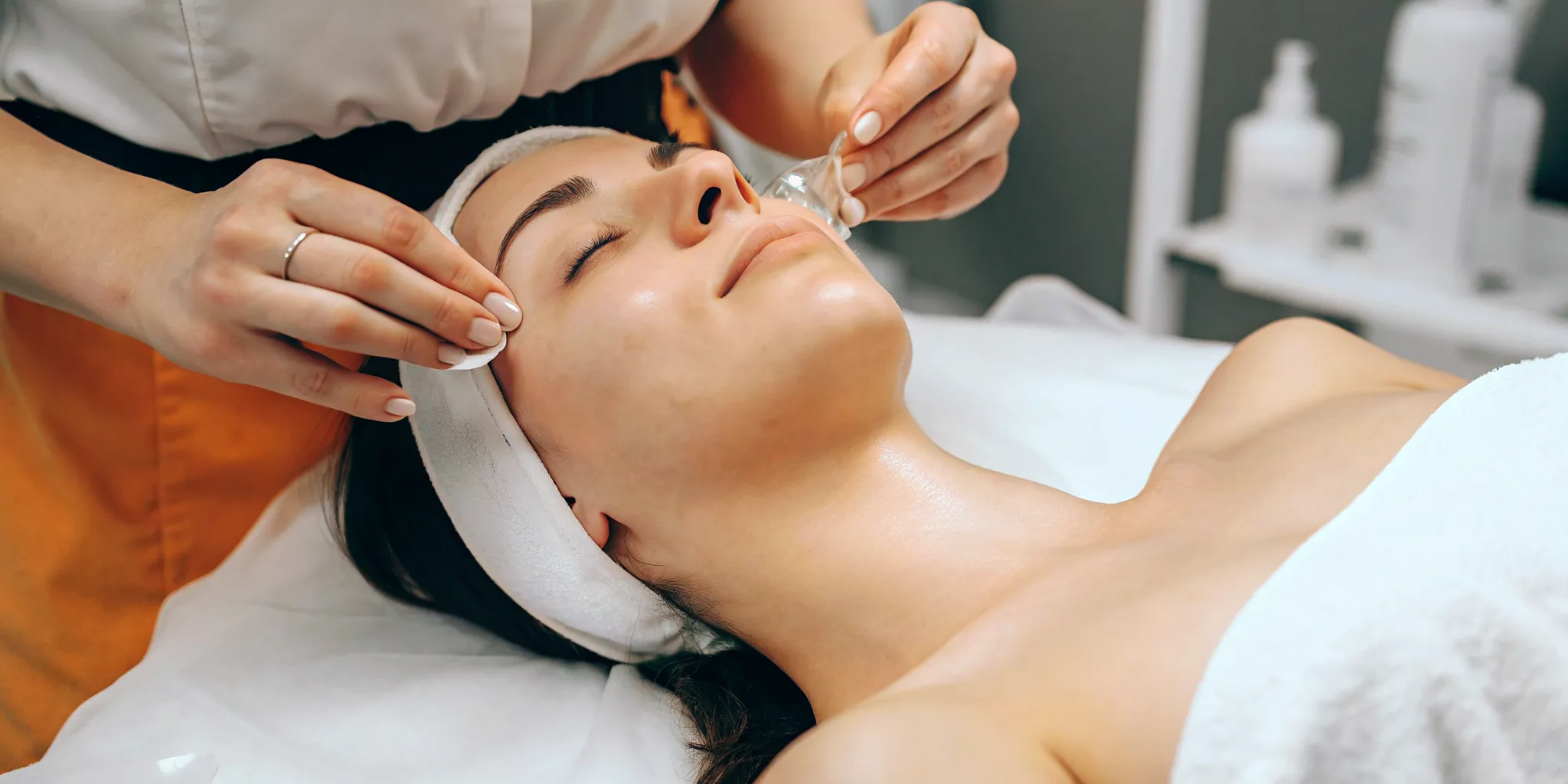 Woman with glowing summer-ready skin preparing for a med spa treatment