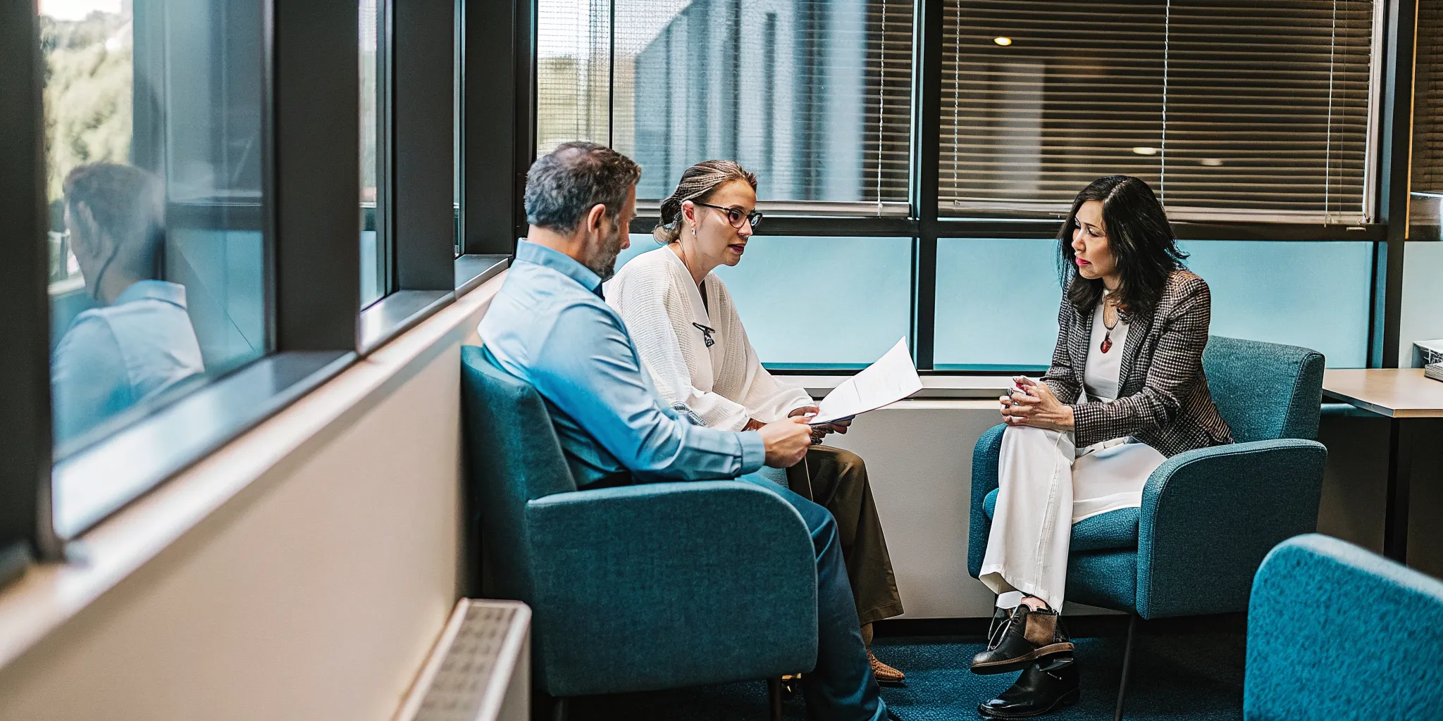 Employer benefits team reviewing health plan contract transparency