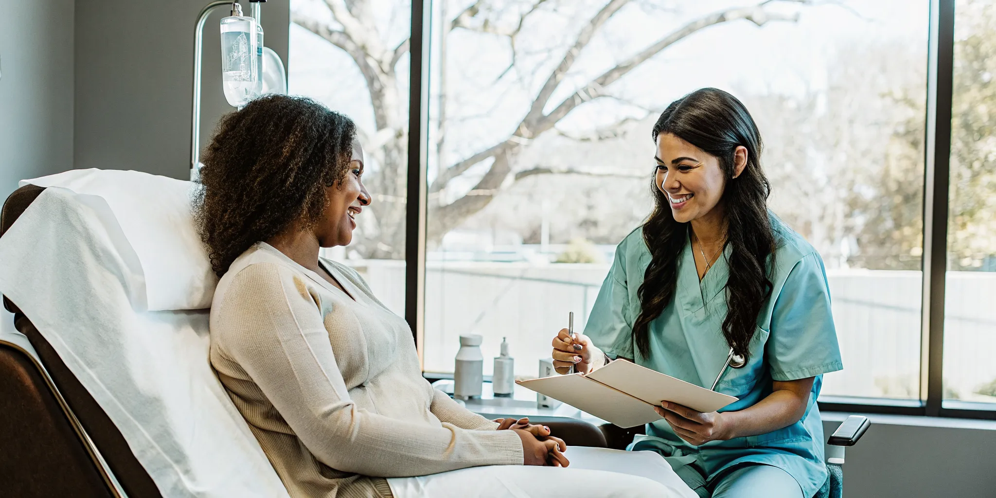Patient reviewing IV therapy Fayetteville AR care plan with a medical provider