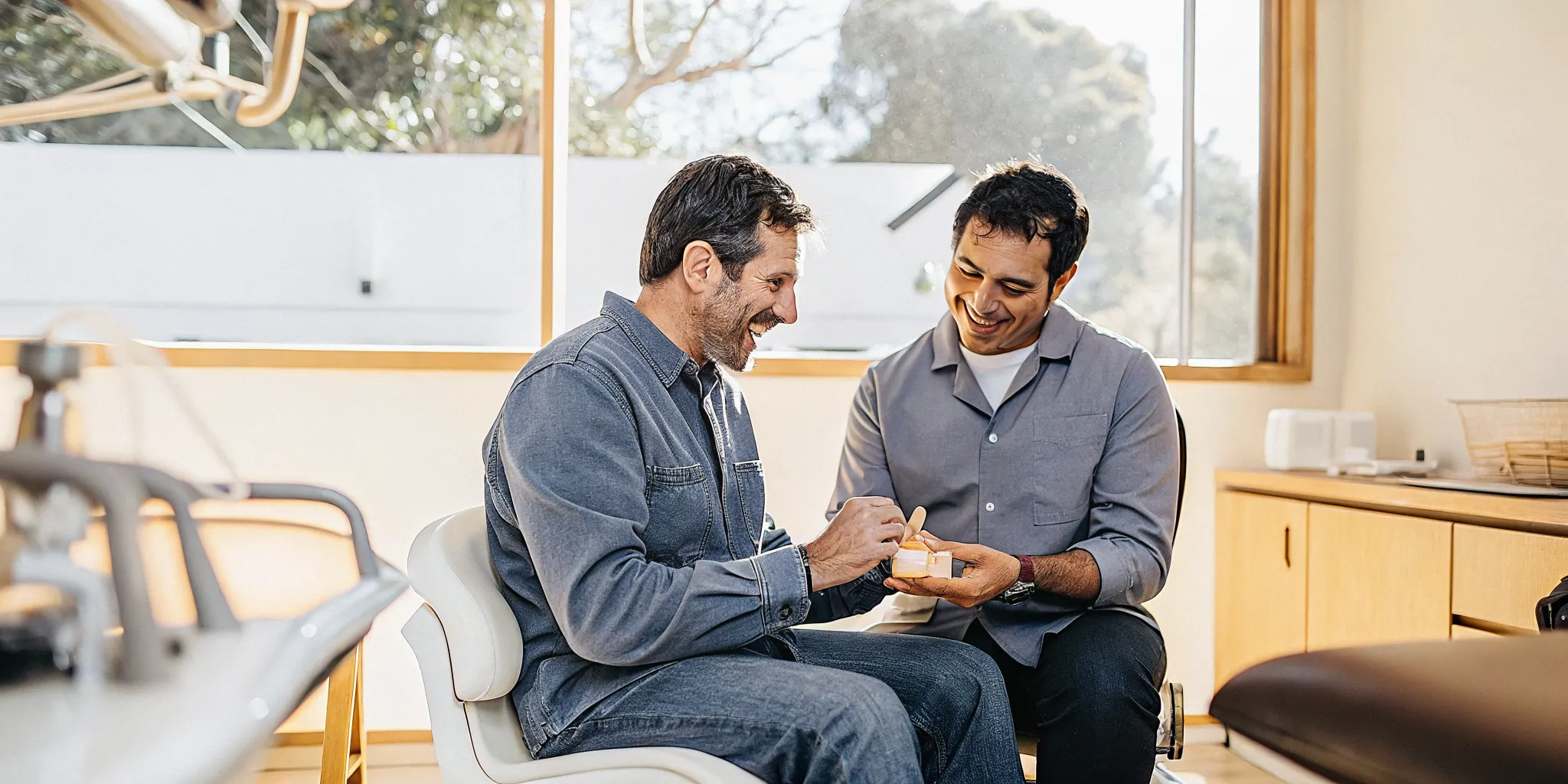 Dentist and patient discussing a dental implant consultation in San Diego
